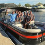 group on red and black premium tritoon boat rental on Cumberland River